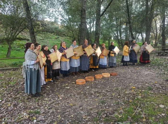 Ladies playing a local music instrument, Adufe, in the center of Portugal